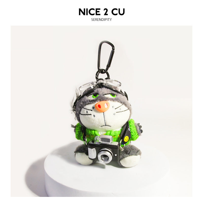Kawaii plush cat bag charm in bright green knitted sweater with miniature camera and carabiner clip