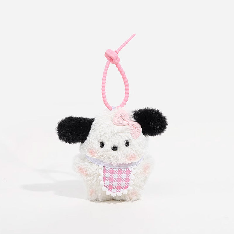 Kawaii plush dog charm with white fluffy body, black floppy ears, pink houndstooth bib with lace trim, and pink bow on head