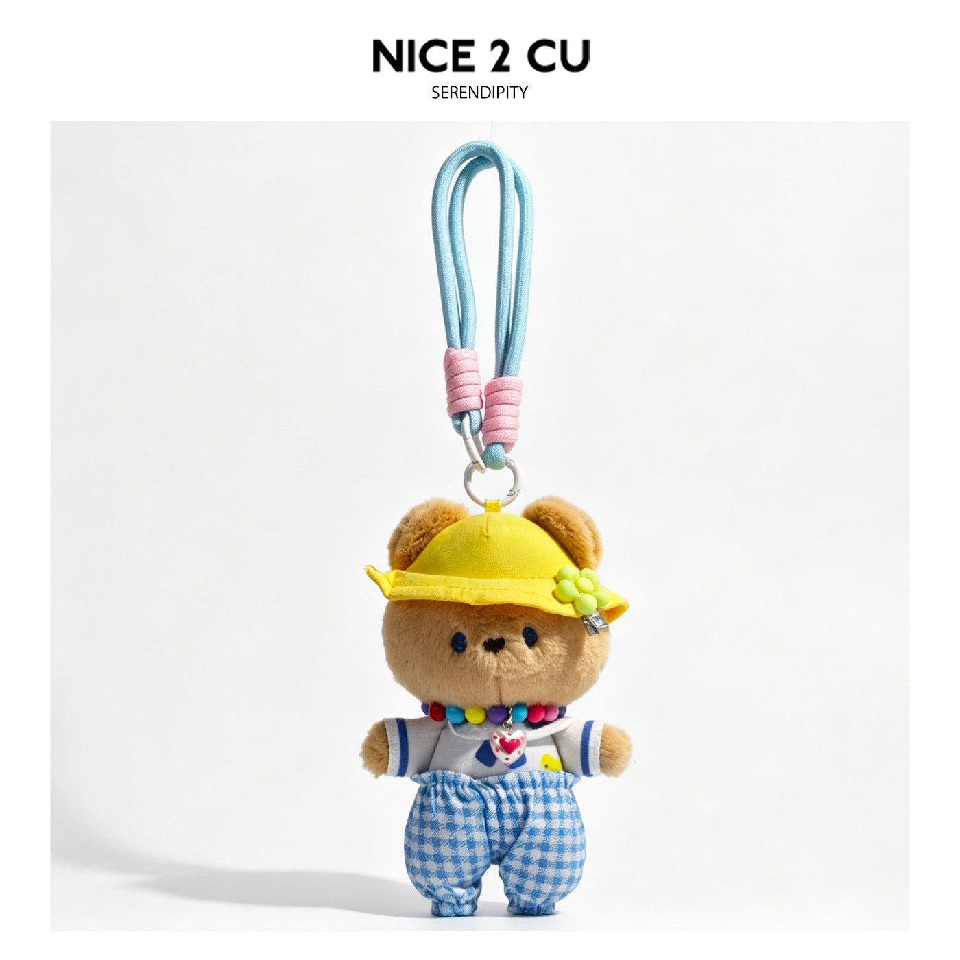 Plush brown bear charm wearing yellow flower hat, blue gingham pants, and multicolor bead necklace with braided light blue lo