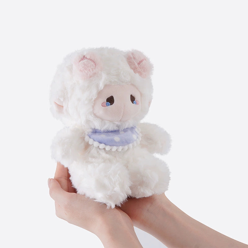 A pair of hands holds the ZEIO Mini Lamb Plush Toy (18cm)—a soft sheep doll in an elegant dress and hat, perfect for kawaii stuffed animal fans.