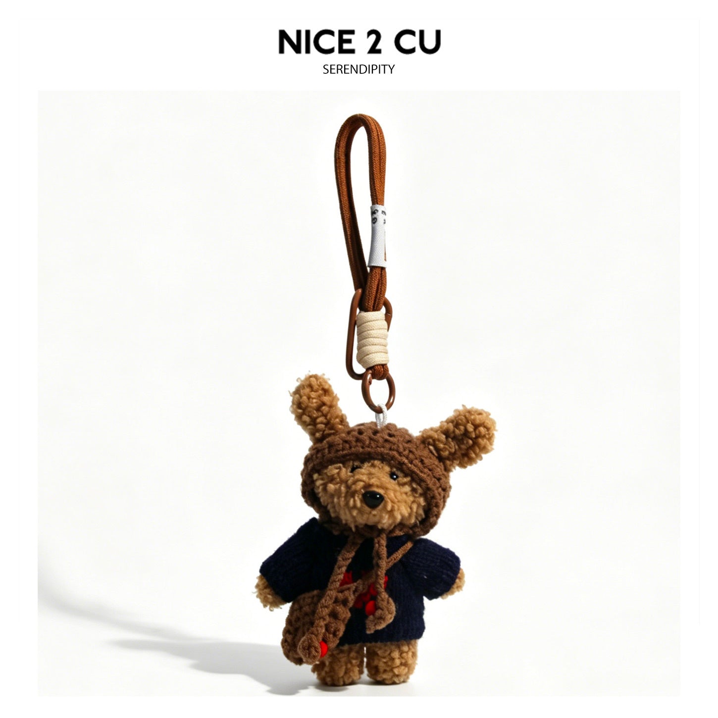 Small bear plush bag charm in a dark navy knitted sweater with brown hood and braided cord loop attachment