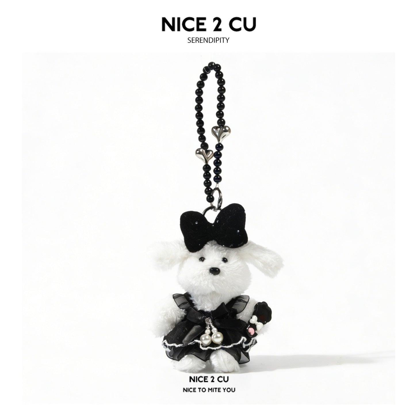 White plush dog charm wearing a black lolita-style dress with a large black head bow and black beaded strap