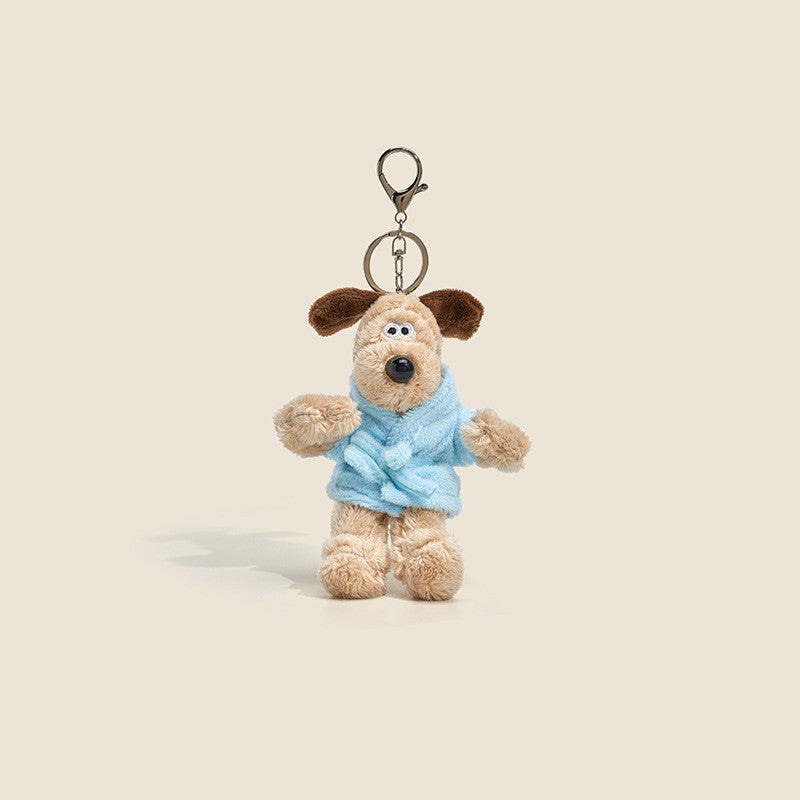 Long-fur cream dog plush charm wearing light blue robe-style outfit