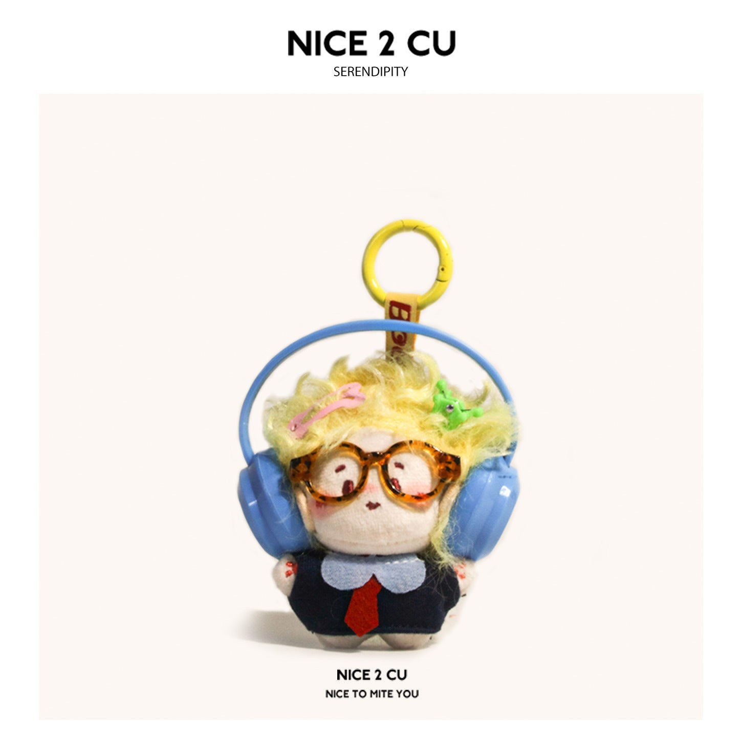 Kawaii chibi plush keychain with yellow afro hair, tortoiseshell glasses, and blue headphones