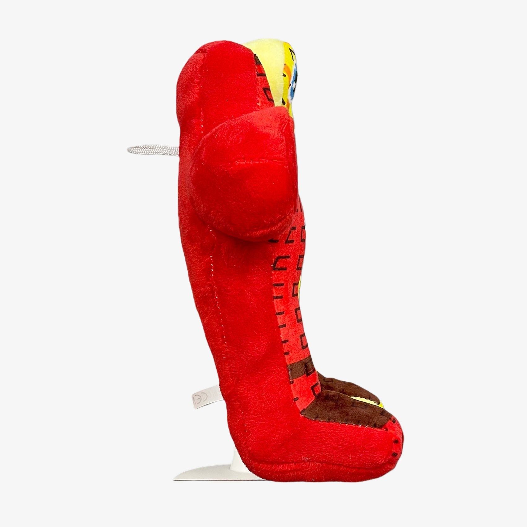 The Steal a Brainrot Inspired Red & Yellow Duo Plush Toy, an 8.7-inch abstract twin character with pixel eyes, is shown upright in profile against a white background.