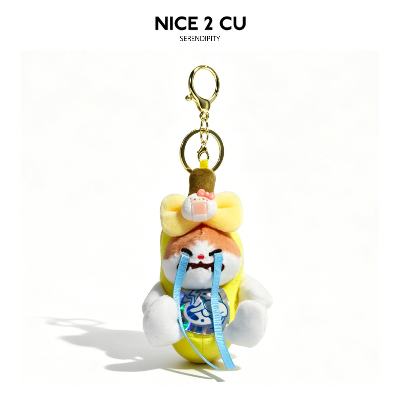 Kawaii crying banana plush keychain charm with yellow bow, pink bandage, iridescent front panel, and gold lobster clasp