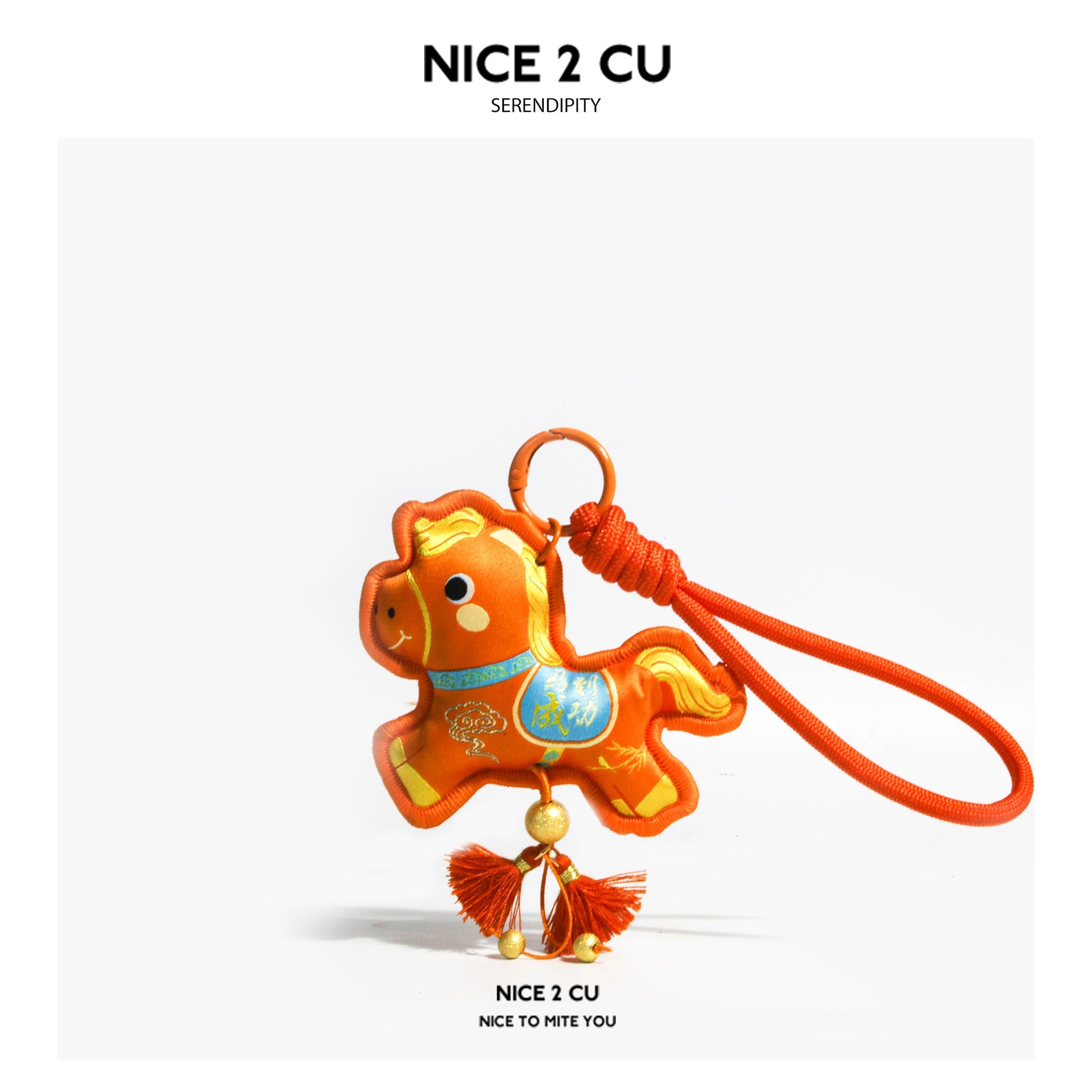 Orange embroidered horse charm with blue chest panel, yellow mane detail, and orange tassels