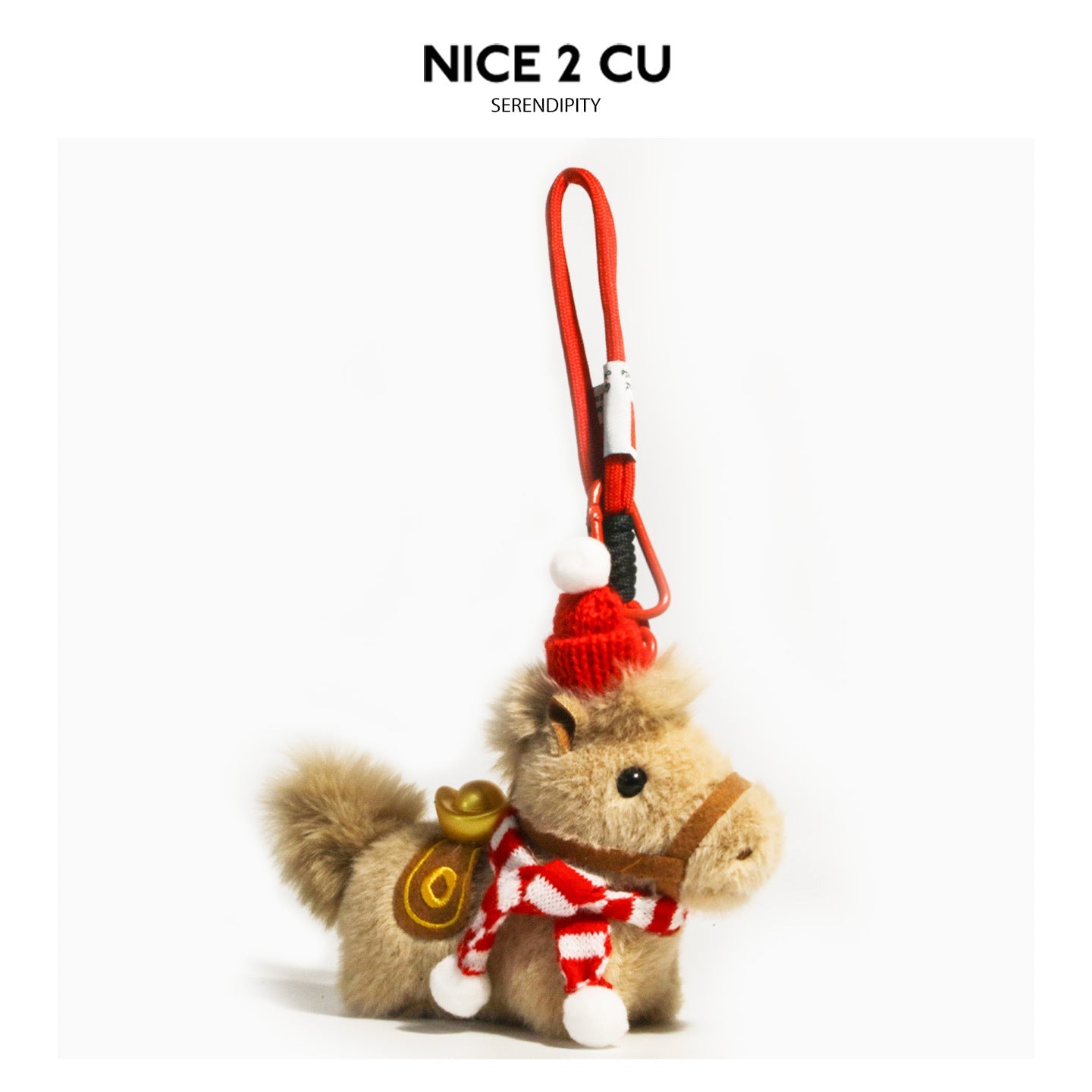 Plush brown horse keychain ornament with red-and-white striped knitted scarf, red beanie hat, and gold saddle accent