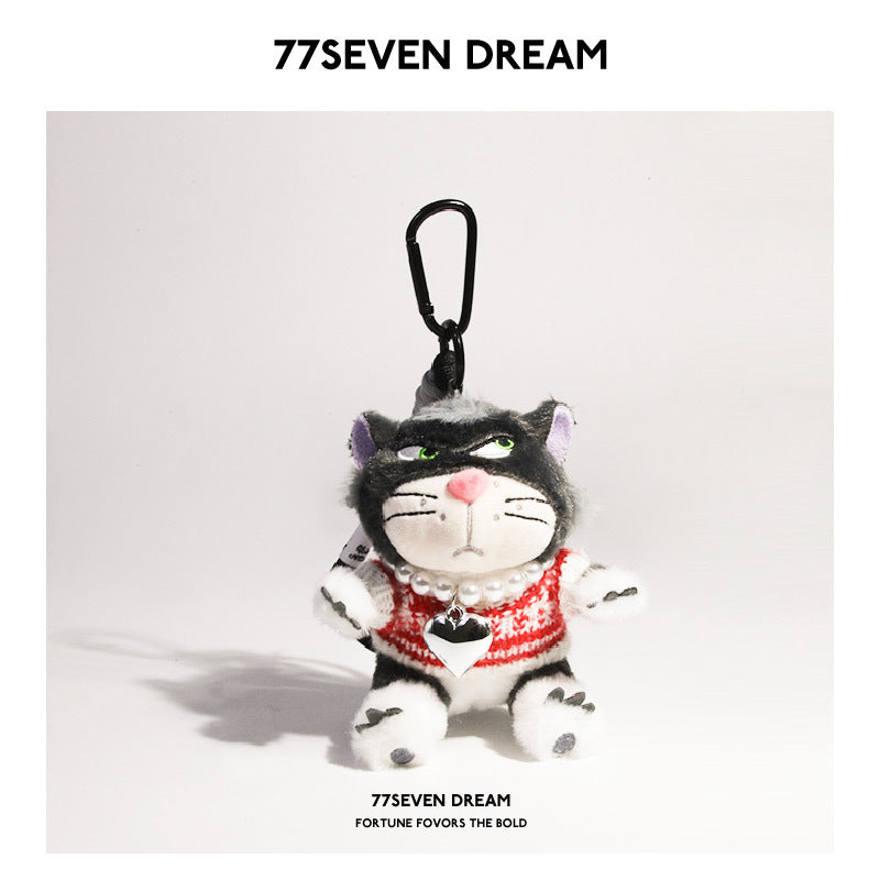 Black-face cat plush charm wearing red and white striped sweater with silver heart pendant