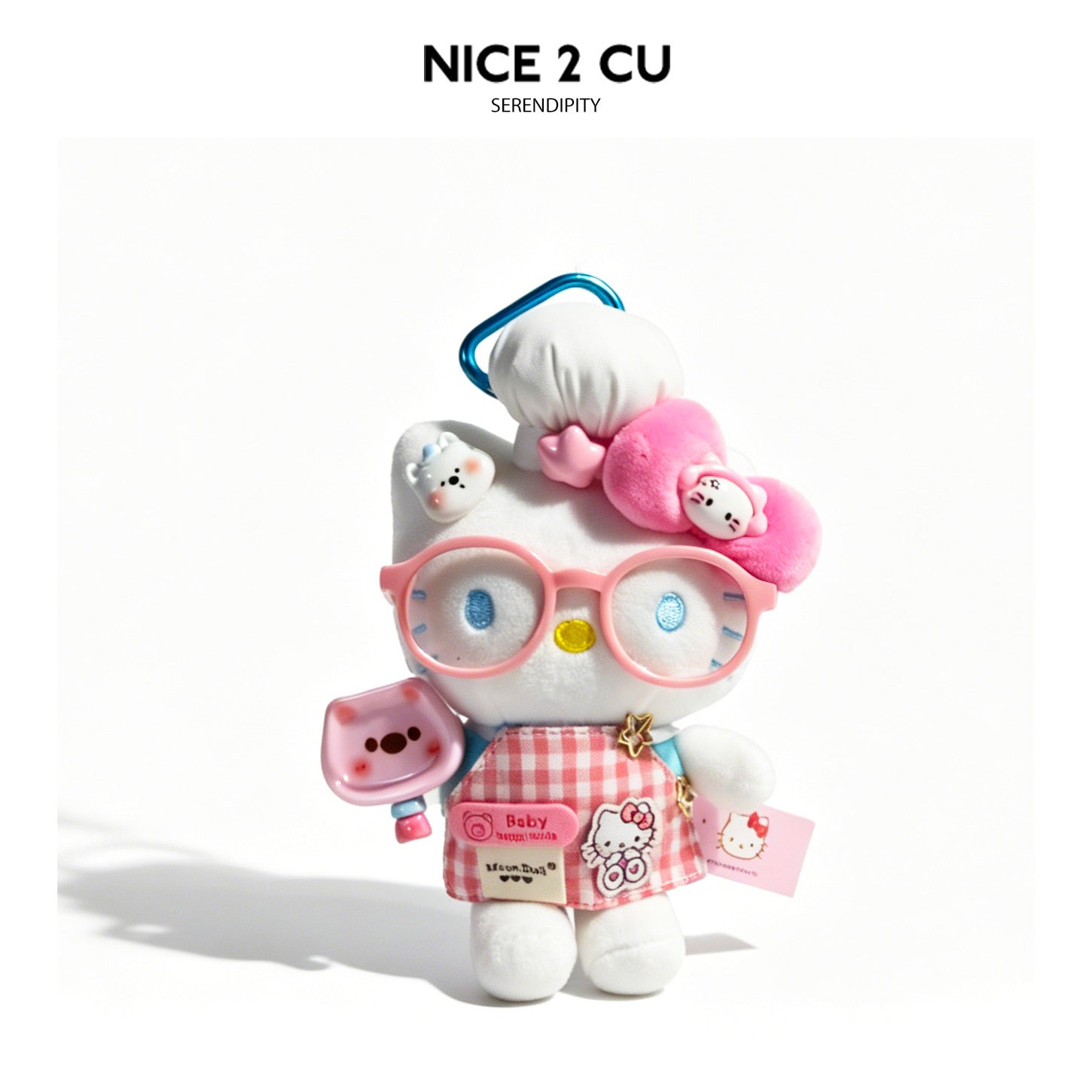 White cat plush charm in pink checkered chef outfit with pink glasses and cooking utensil accessory