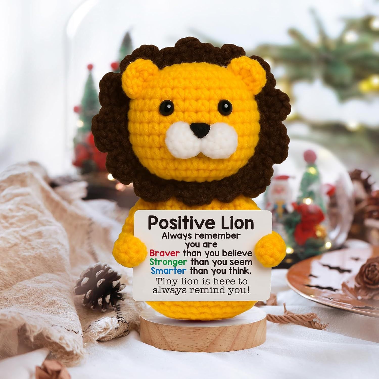 ZoDoll's Positive Lion Crochet Amigurumi is an inspirational plush toy featuring a brown-maned lion holding a sign that reads, "Always remember you are braver, stronger, and smarter than you think"—the perfect encouragement gift.