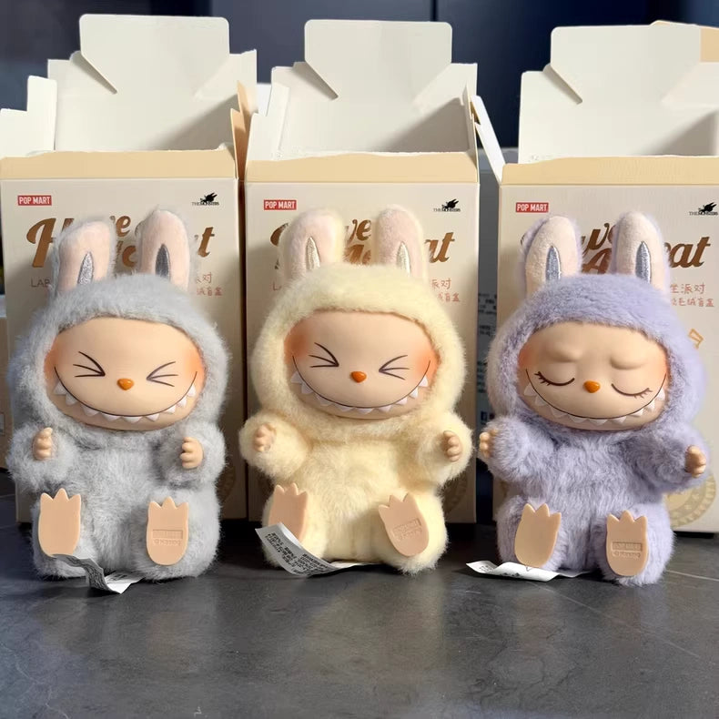 The Labubu Have a Seat Series – Complete 6-Piece Plush Keychain Set by POP MART features six unique collectible figures, each in different outfits, displayed with cream-colored boxes behind them. No duplicates included.