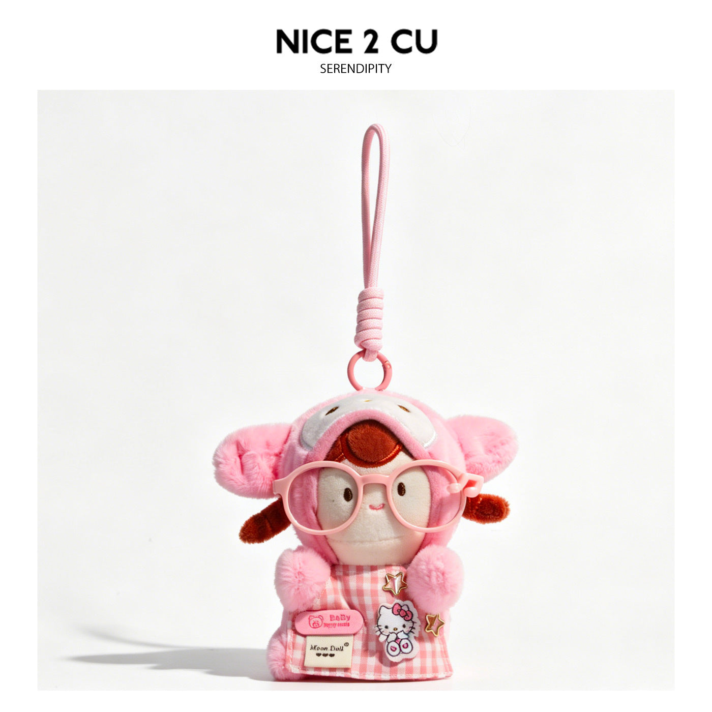 Pink kawaii plush doll charm wearing animal-ear hood, oversized pink glasses, and gingham bib-apron with cat patch and star p