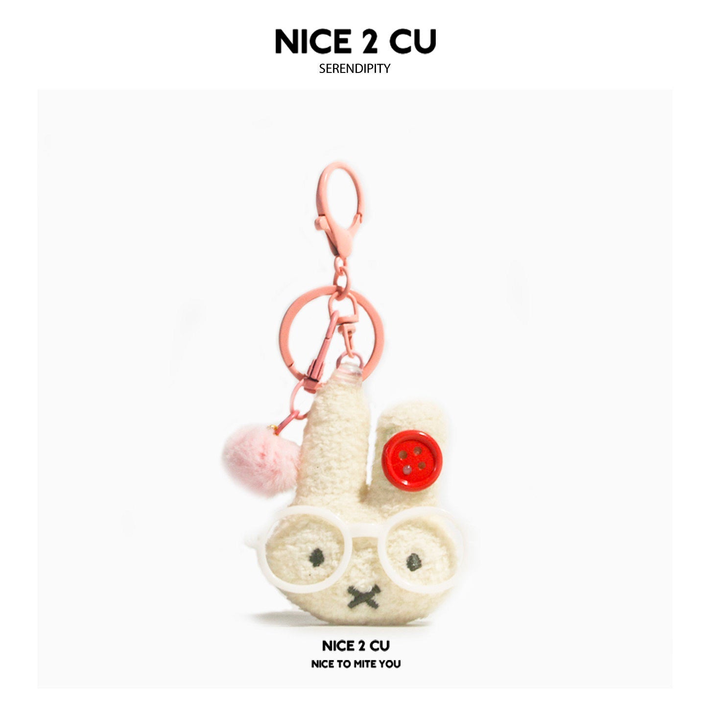 Pink rabbit plush clip charm with round white glasses and pink pom-pom accent on cream figure