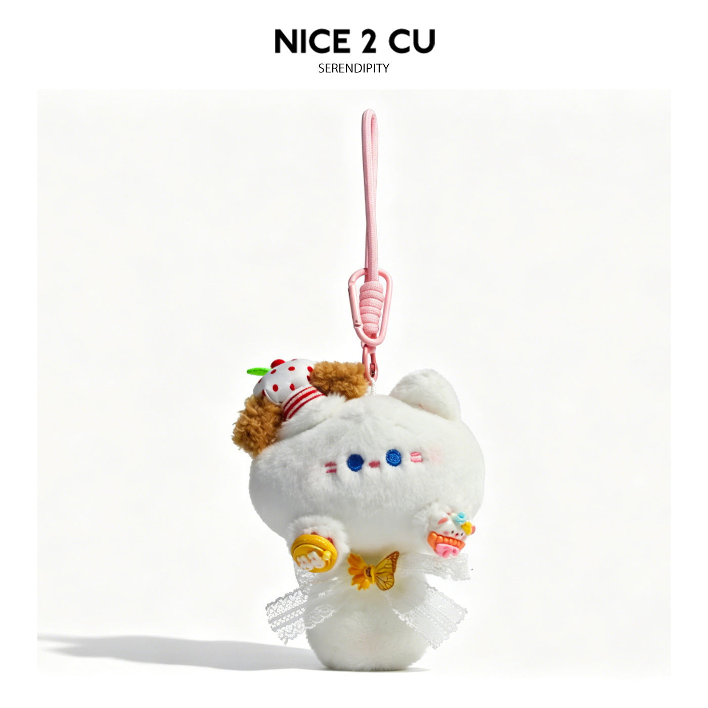 White plush cat bag charm with lace bow, yellow butterfly accent, and pink loop strap