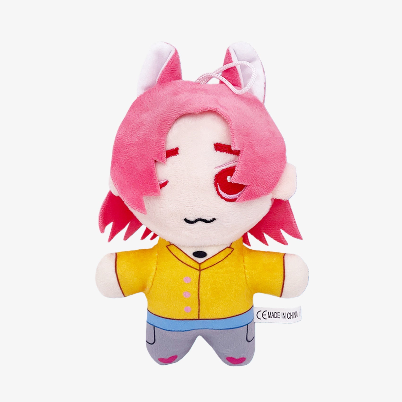 Demon Hunters Anime Plush Doll 8-Inch features a pink-haired, fox-eared female character with a yellow shirt, blue pants, and red eye patch. This soft stuffed toy includes a handy hanging loop and is shown against a white background.