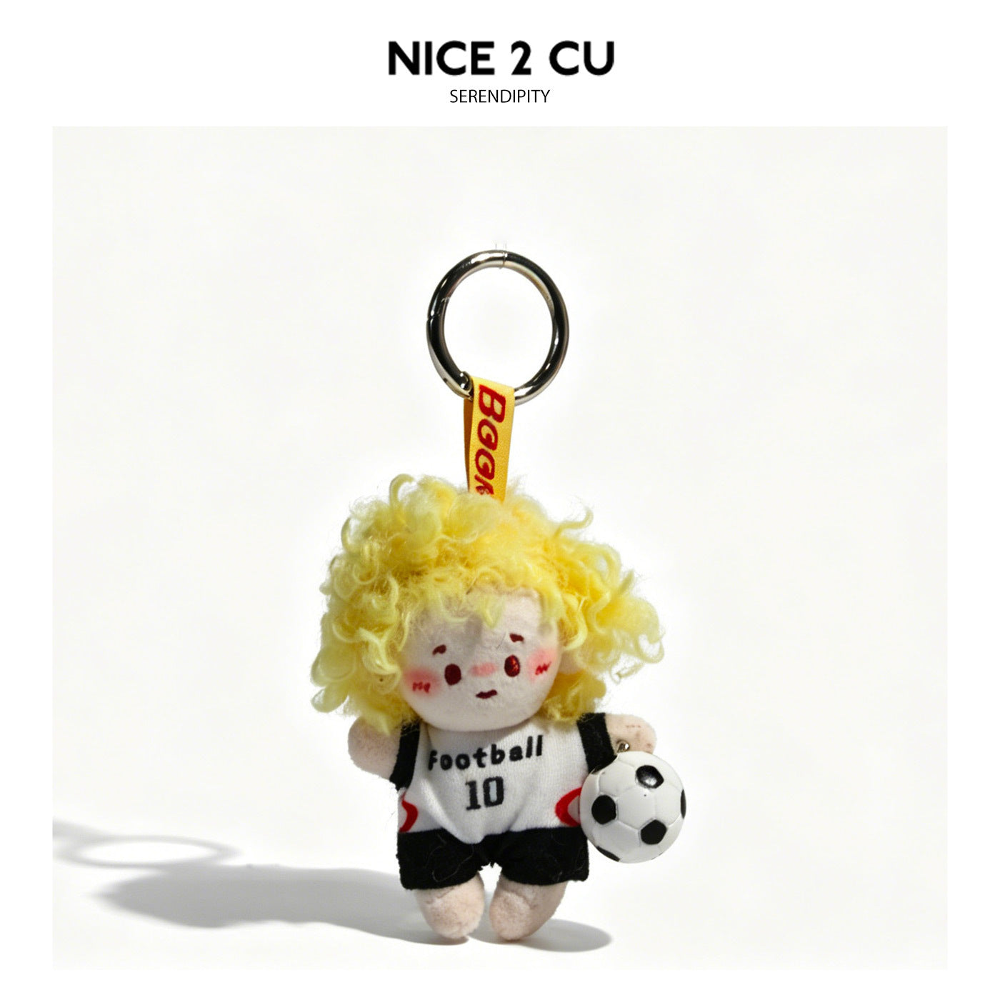 Plush soccer kid bag charm with bright yellow curly hair and white football jersey with black accents