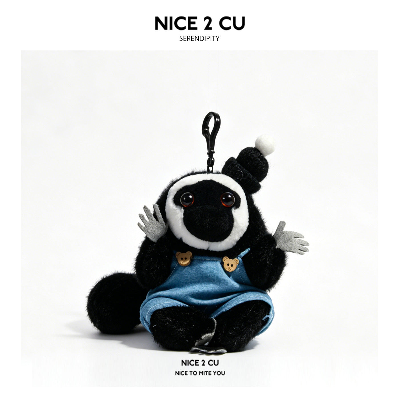 Serendipity Dudo black and white plush charm in blue denim overalls with bear-shaped buttons and swivel clip