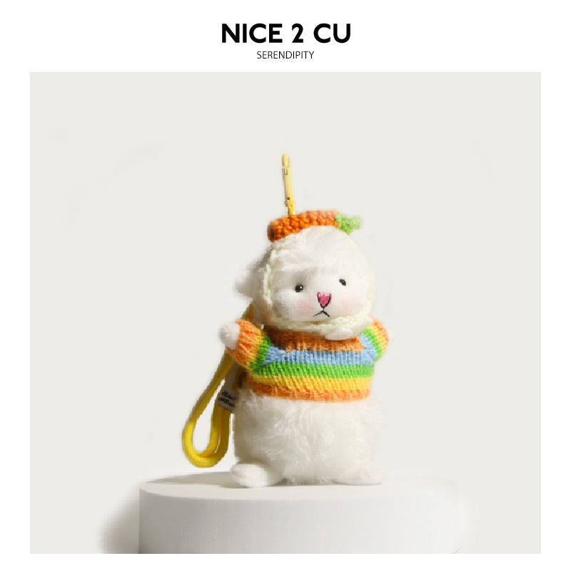 White fluffy lamb plush charm in a rainbow-striped knitted sweater and orange knitted cap with yellow loop cord