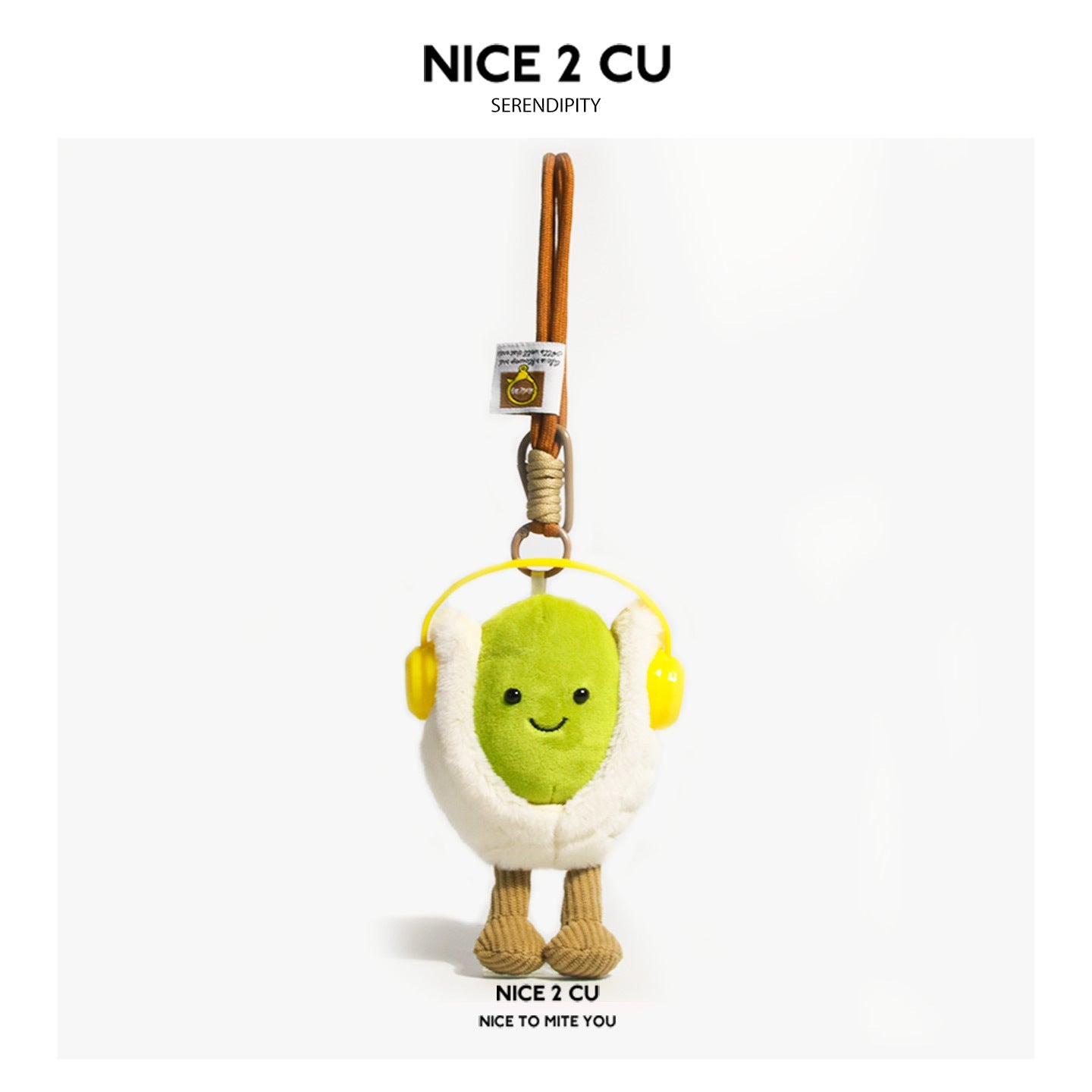 Pistachio plush bag charm with yellow headphones, green kernel body, and corduroy legs