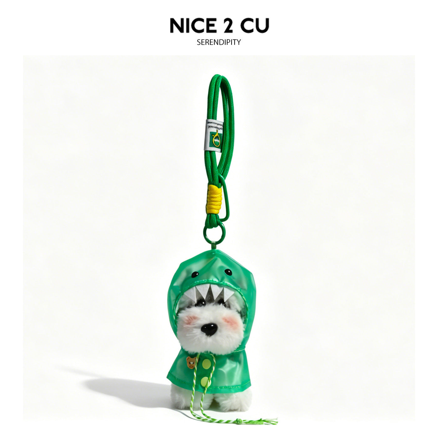 Schnauzer plush charm wearing a green monster-style hooded raincoat with tooth detail and green braided lanyard