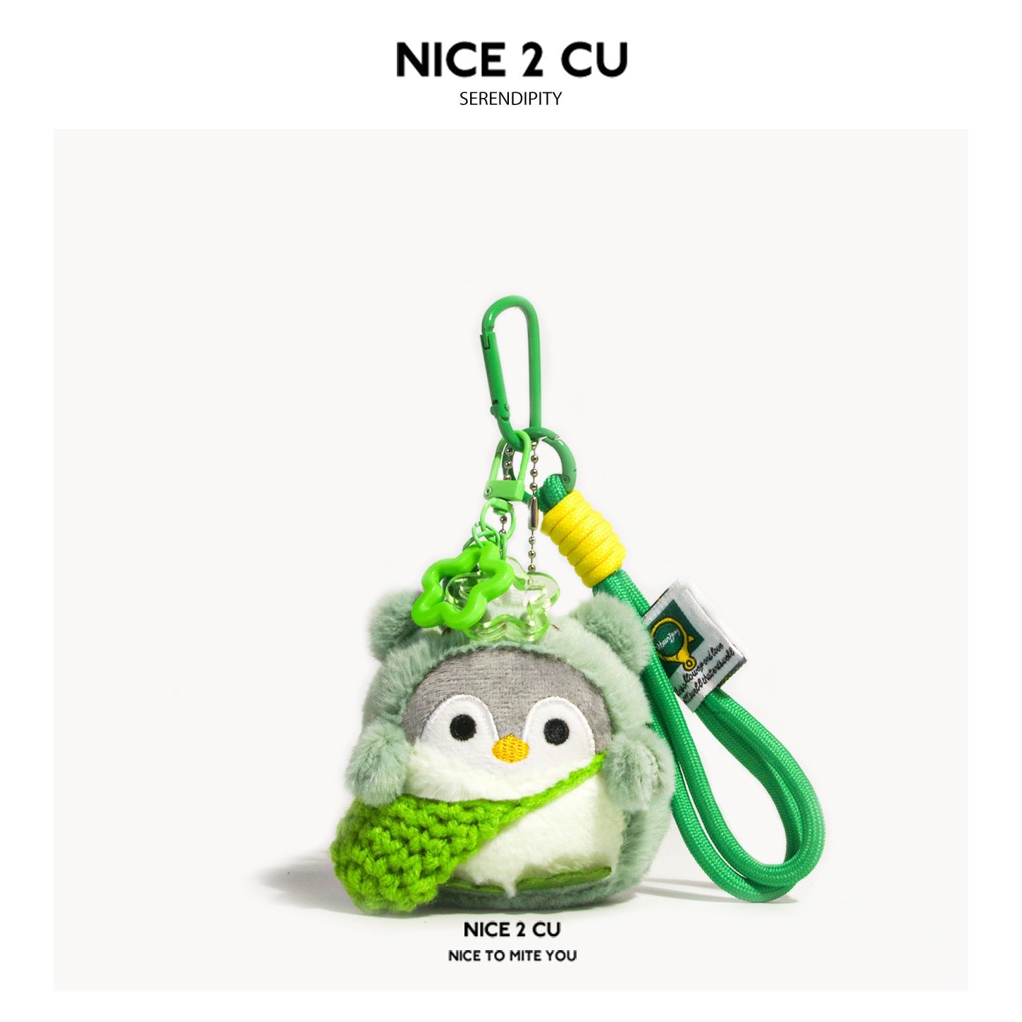 Green kawaii penguin plush keychain charm with green knitted scarf and star accessories