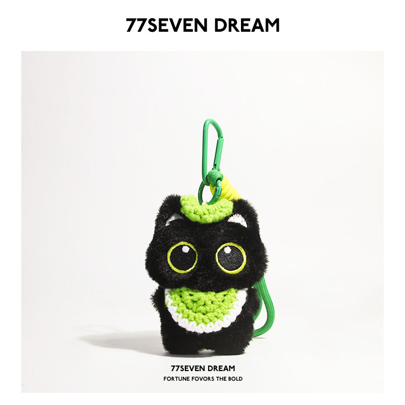 Black cat plush charm with green-outlined eyes and green crocheted bib, green carabiner clip
