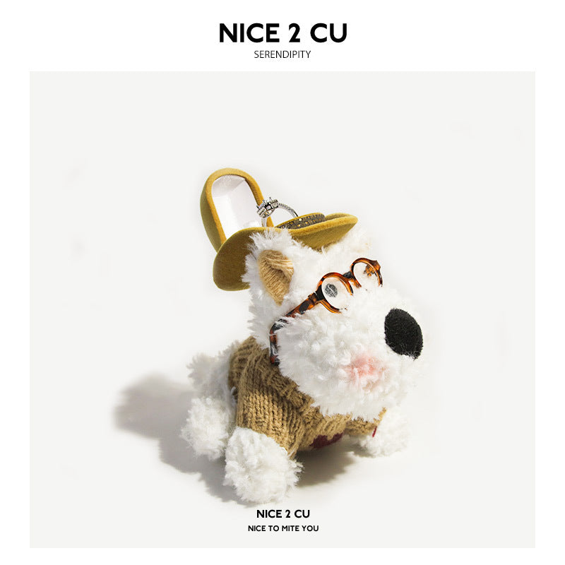 Fluffy white dog plush keychain charm wearing a mustard wide-brim hat, round tortoiseshell glasses, and a knitted khaki outfi