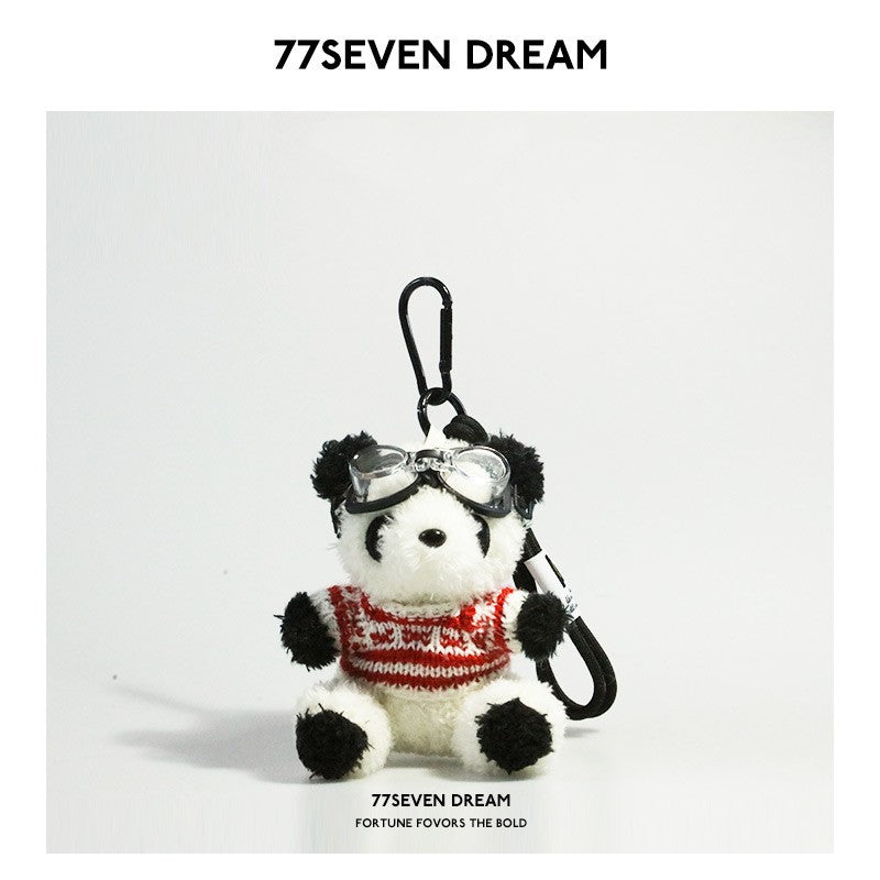 Panda charm with clear aviator goggles in red and white patterned knitted sweater