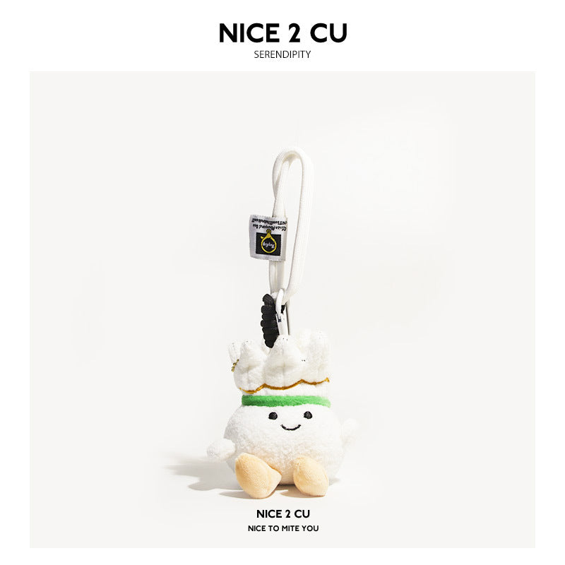 Soft plush shuttlecock charm with white hanging cord, embroidered smile, and feather-crown top