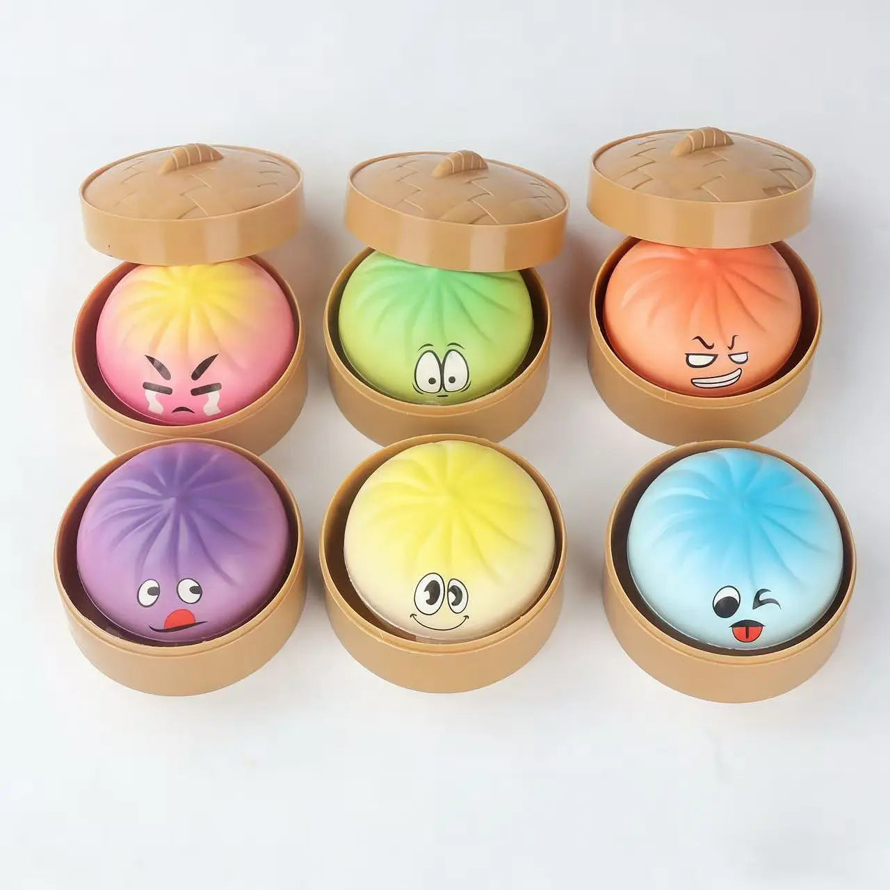 The ZoDoll Giant Emoji Squishy Dumpling Bun Sensory Fidget Toy features six colorful kawaii expression buns in a rainbow steamer basket. This stress relief squishy toy is perfect for kids and adults to squeeze and enjoy.