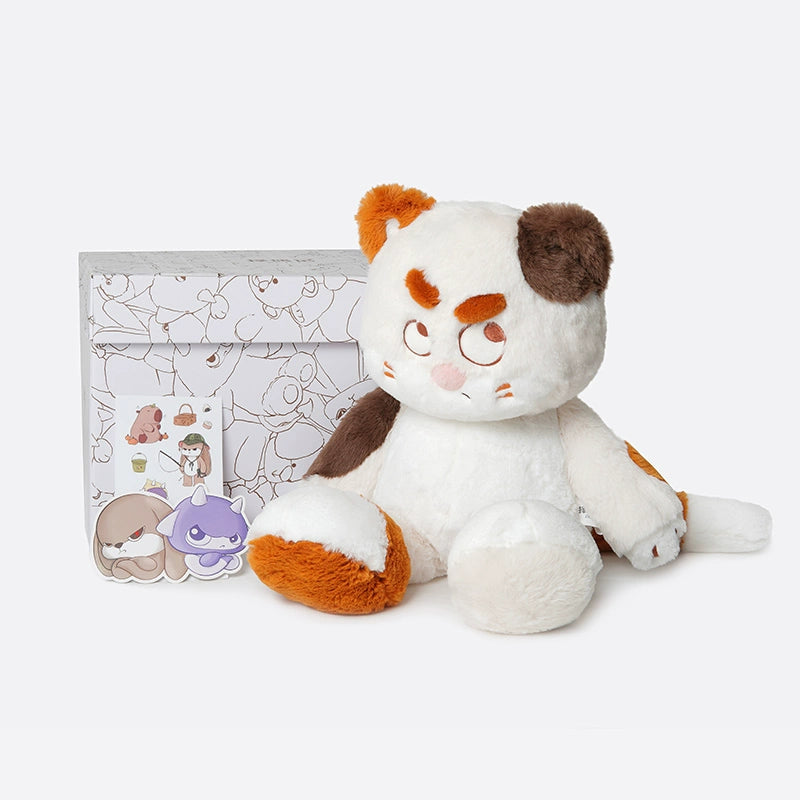 The ZEIO Cat Plush Toy 50cm is a soft, large stuffed cat with an expressive face, featuring brown and orange patches. It sits in front of a box decorated with cat illustrations plus two cat-themed stickers.