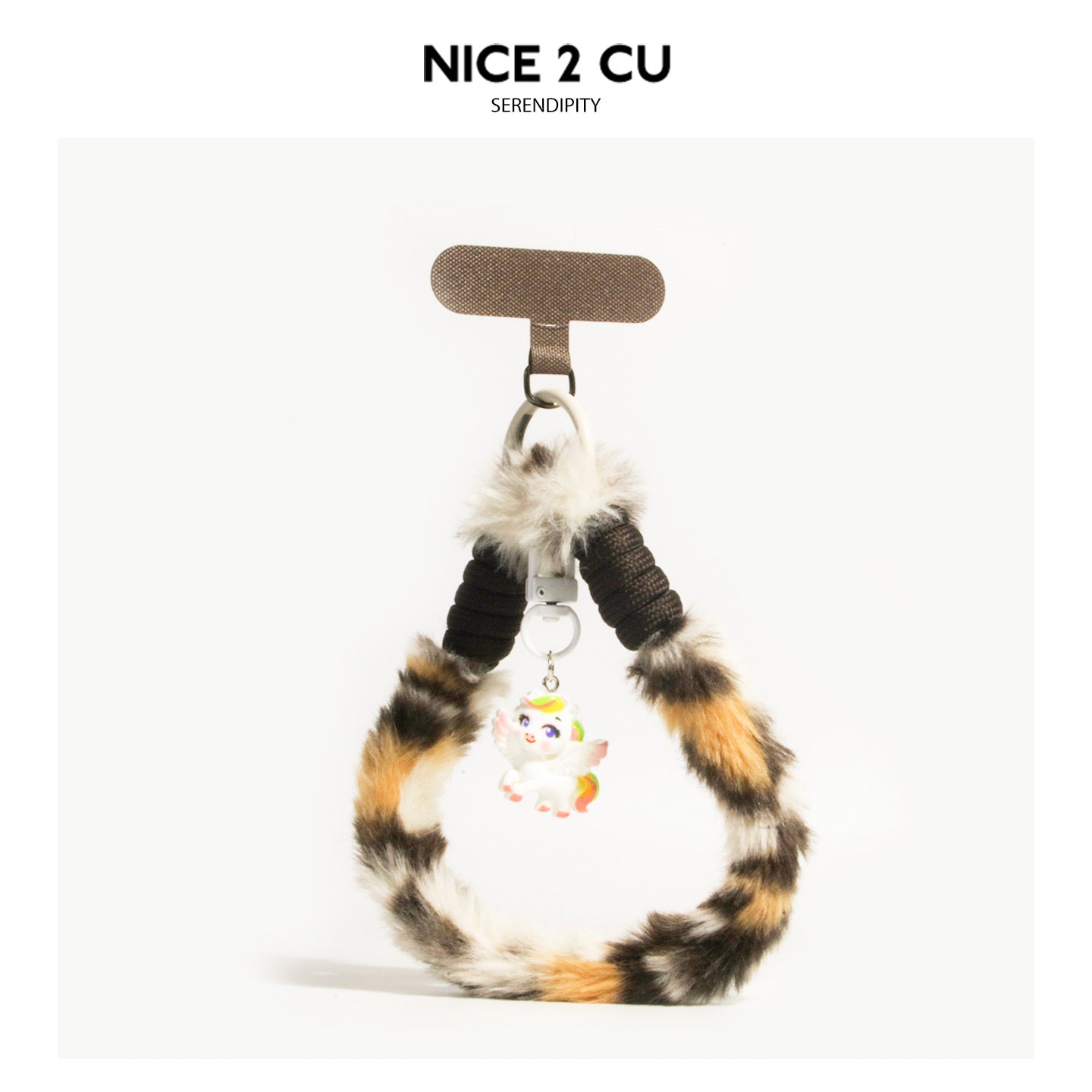 White and black fluffy leopard-print phone wrist strap with tan accents and unicorn charm pendant