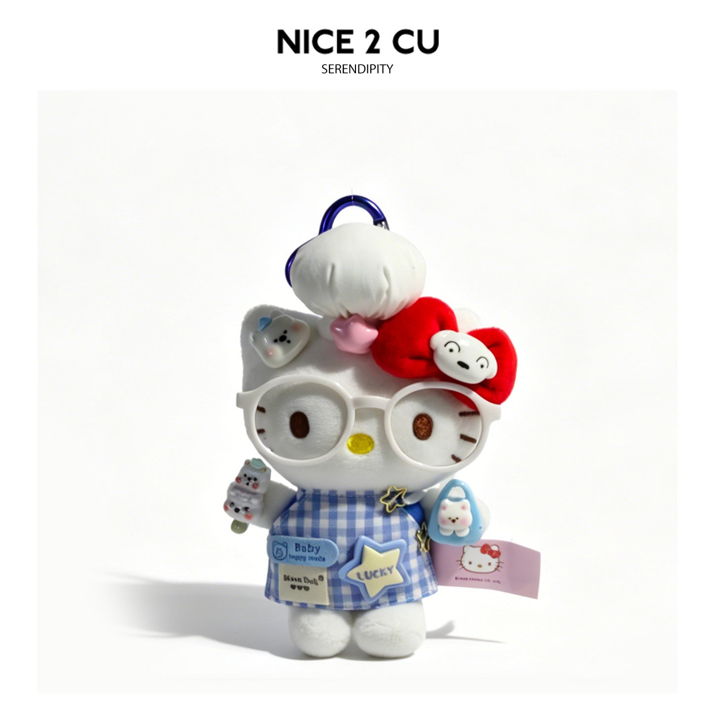 White cat plush charm in red polka-dot dress with red glasses, bow, and spoon accessory