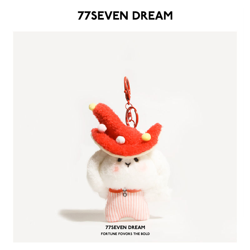 White rabbit plush keychain charm wearing a red mushroom hat with pom-pom dots and pink striped outfit, metal lobster-claw cl