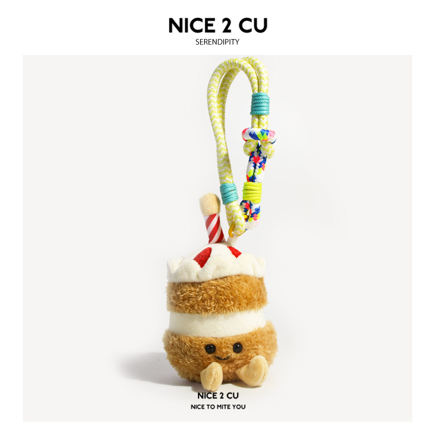 Brown layered birthday cake plush keychain with red-and-white candle topper and multicolor rope loop