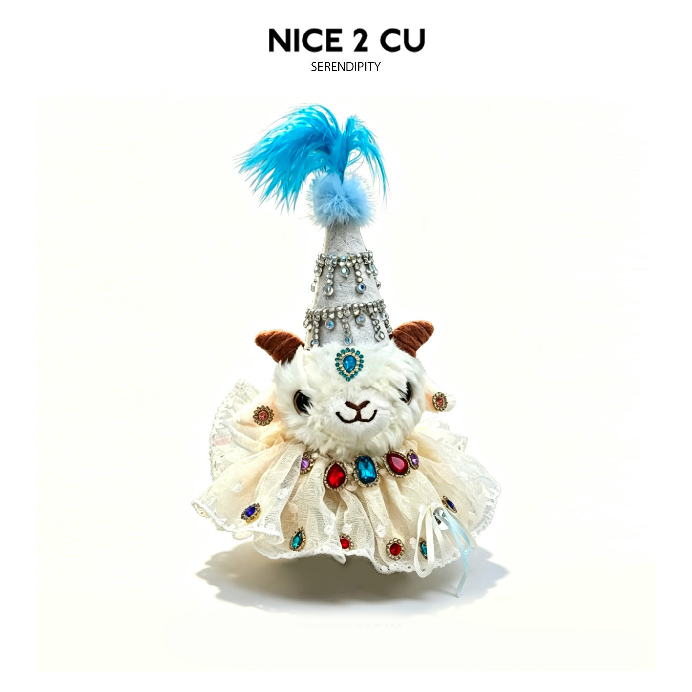 Plush lamb figurine in cream-white lace dress with pale blue feathered hat and colorful gem accents