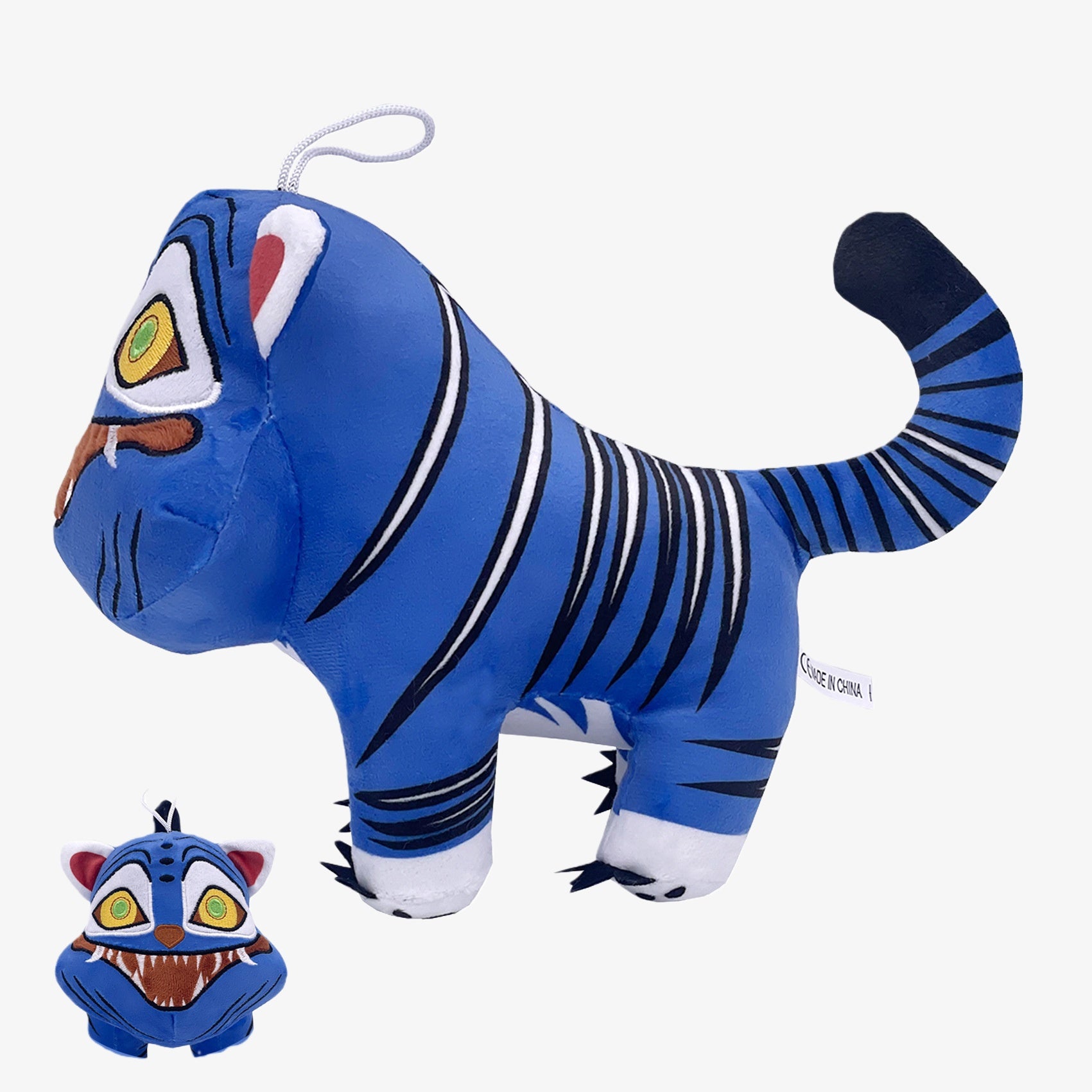 The Demon Hunters Monster Plush Doll is a 10-inch blue tiger creature with black stripes, large yellow eyes, a curved tail, and a hanging loop; a smaller version appears in the bottom left corner.