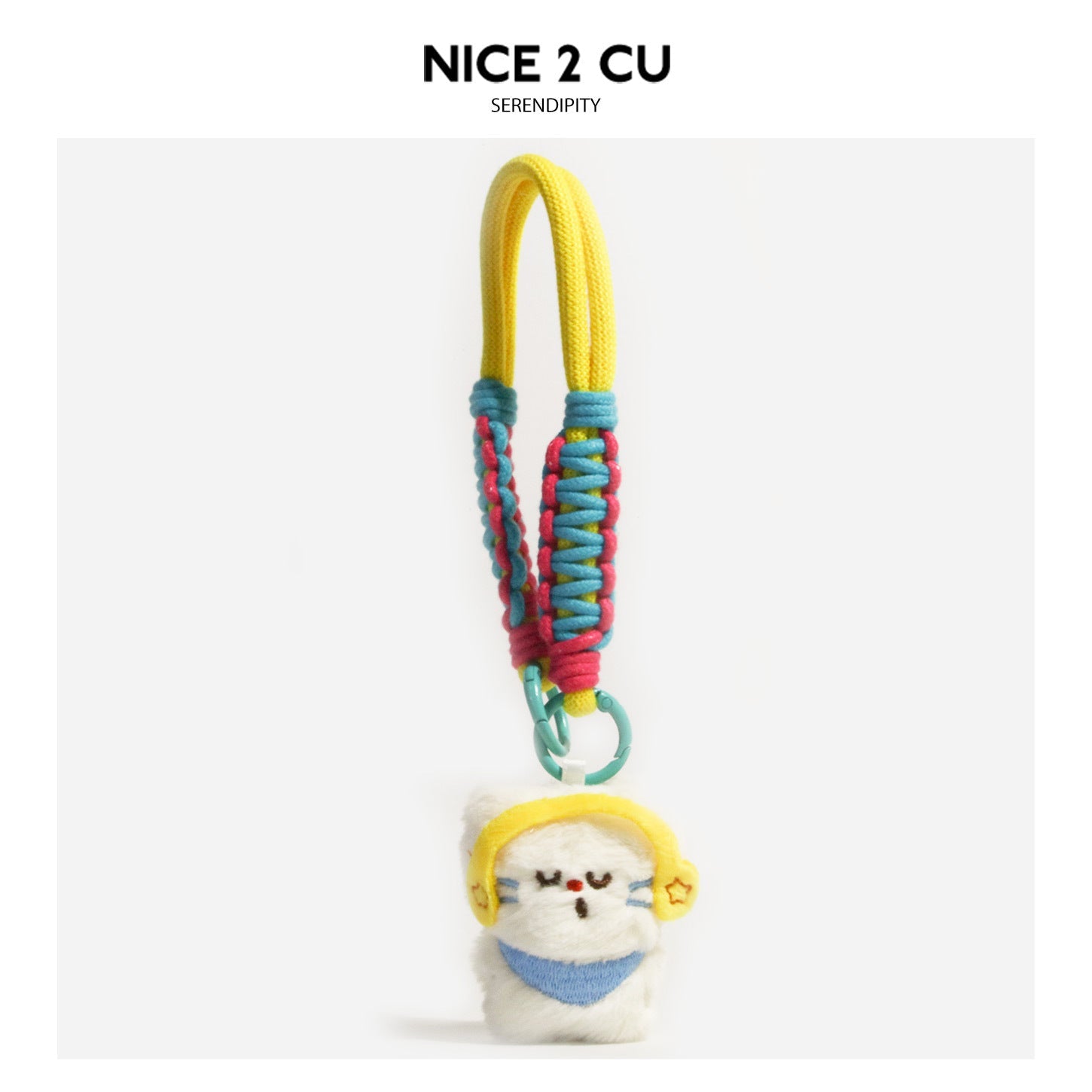 White plush cat charm with yellow ear covers, blue front panel, and multicolor braided cord