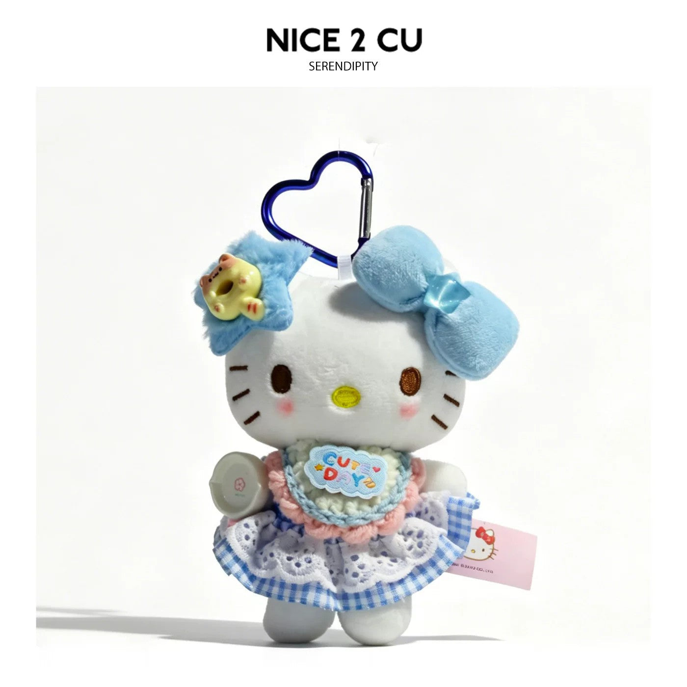 Kawaii cat plush bag charm with blue star headpiece, blue bow, and blue-and-white lace outfit