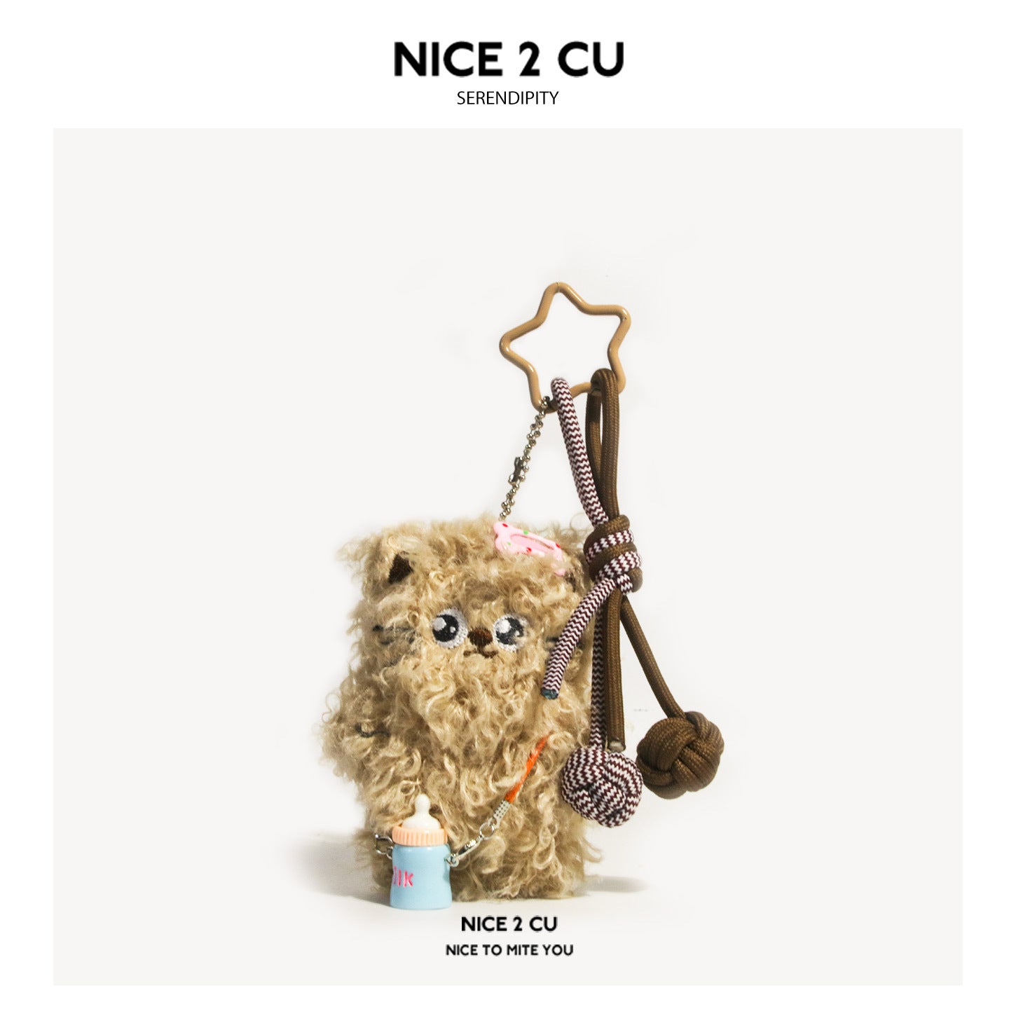 Light brown fluffy plush cat charm with star ring, braided paracord, and miniature blue bottle charm