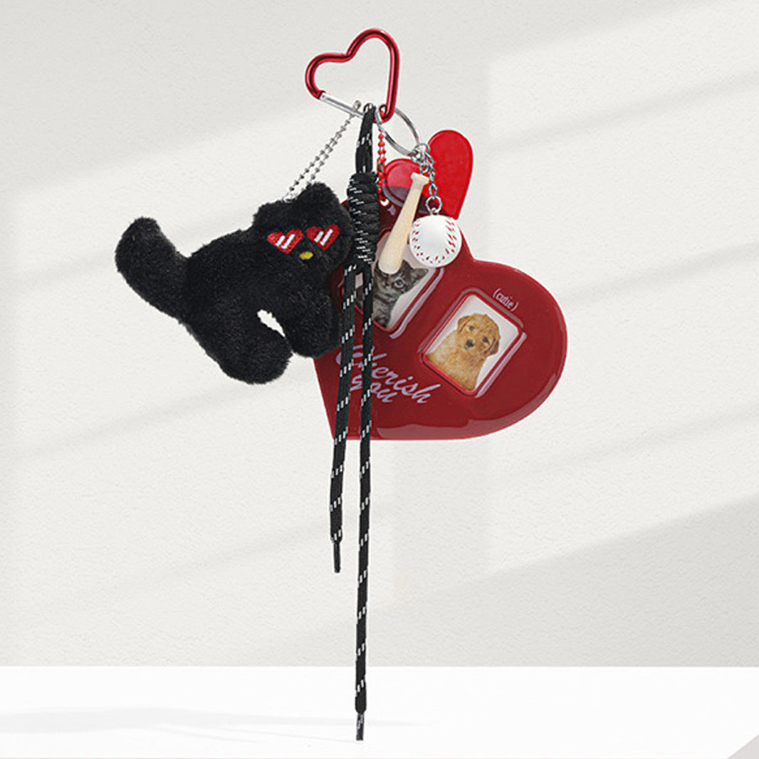 Red heart acrylic photo card holder bag charm with black cat plush in heart sunglasses, baseball bat charms, and black-and-wh