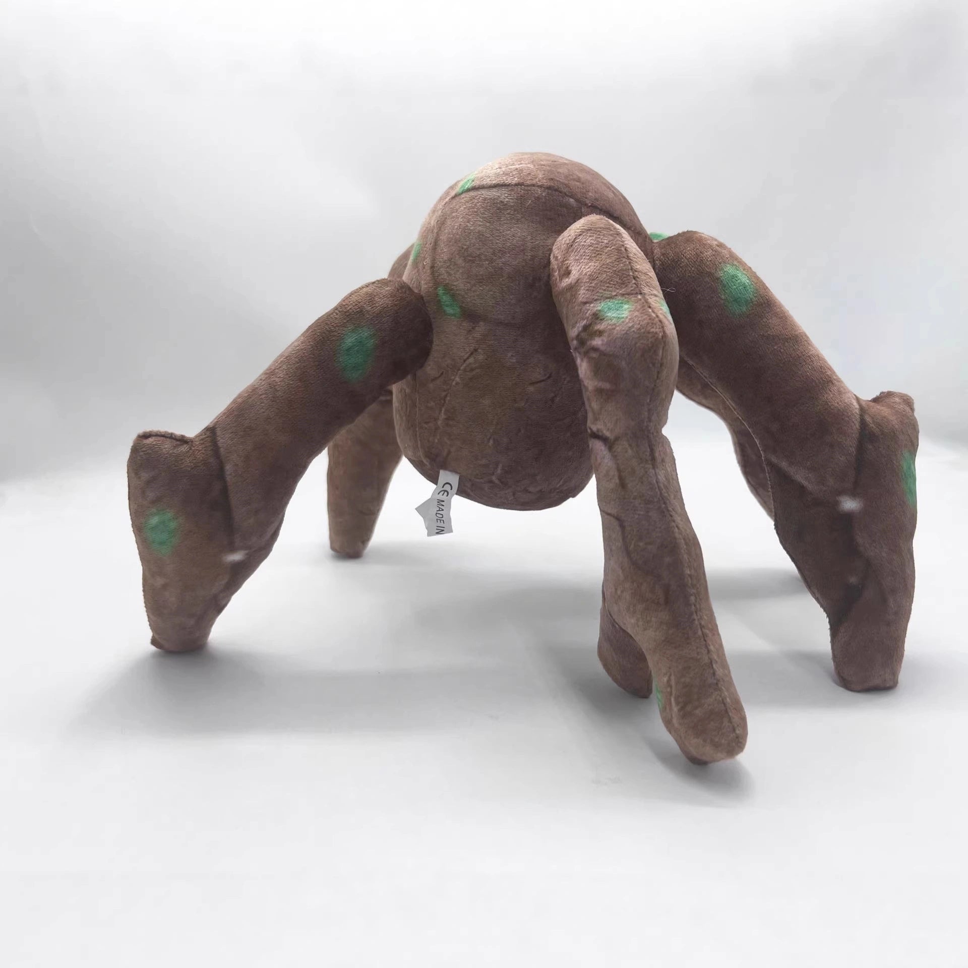 The ZoDoll Rocky Plush Project Hail Mary 20.2cm Alien Companion Stuffed Toy features four legs and green spots, making it the perfect collectible inspired by Project Hail Mary, shown standing on a plain white background.