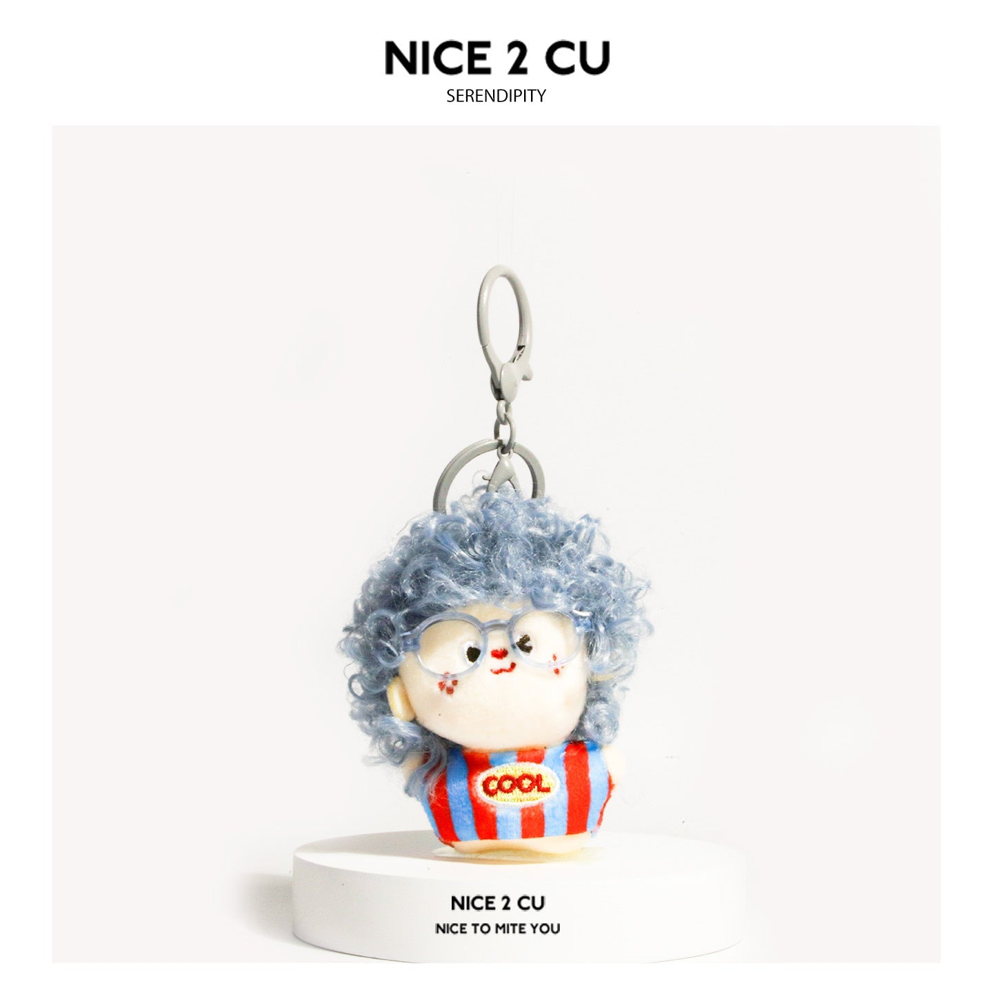 Light blue curly-hair plush doll keychain with blue glasses and COOL patch, blue-red striped outfit, orange clasp