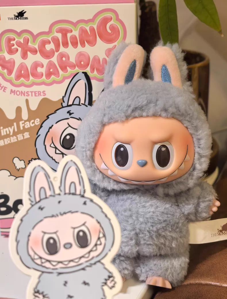 The Labubu “Sea Salt Coconut” Plush Keychain from POP MART features a standing bunny in blue sherpa, shown with its illustrated packaging—a must-have kawaii collectible for Pop Mart The Monsters fans.