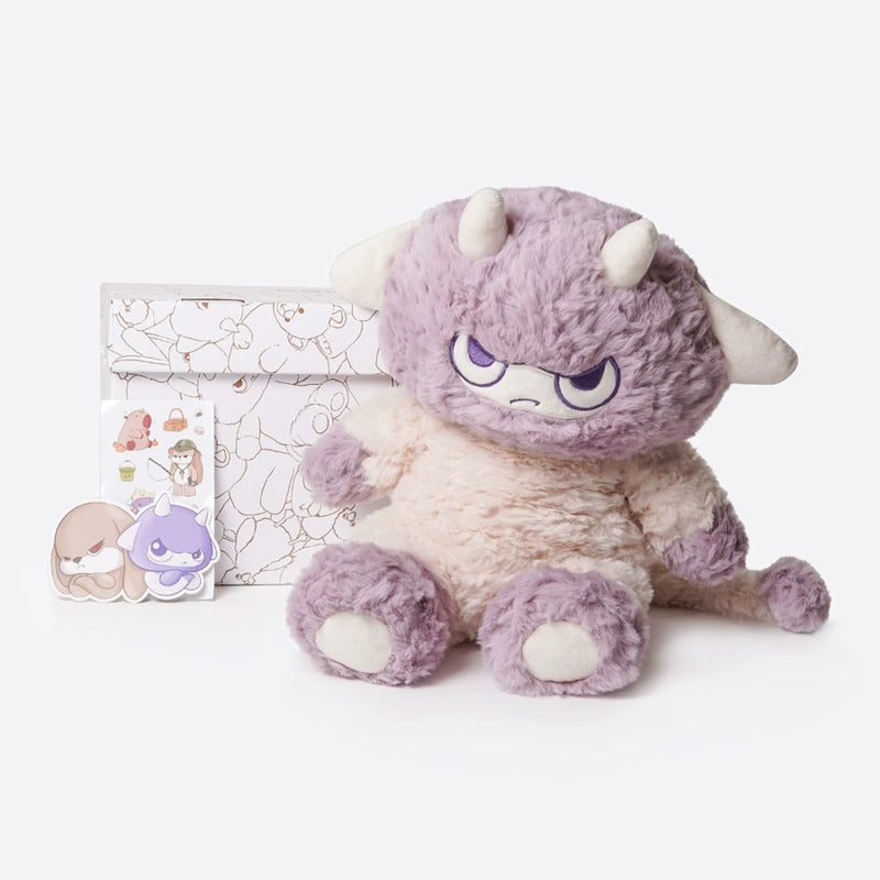 The ZEIO Lilith Demon Lamb Plush Toy (32cm) with purple and cream fur, white horns, and an angry face sits by an illustrated envelope and two character stickers on a white background.