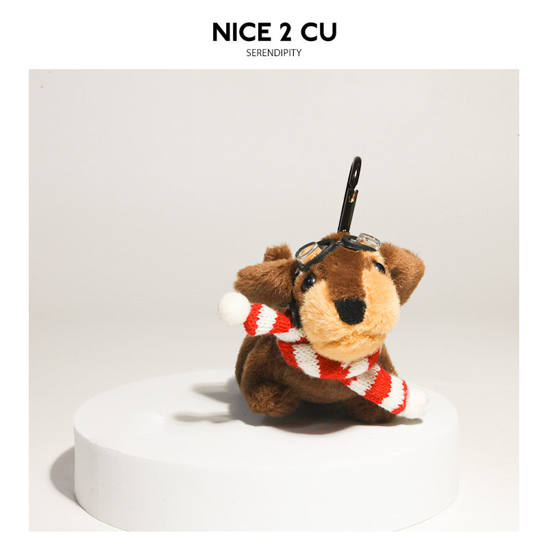 Plush dachshund charm wearing a red and white striped scarf with goggles and black clip strap