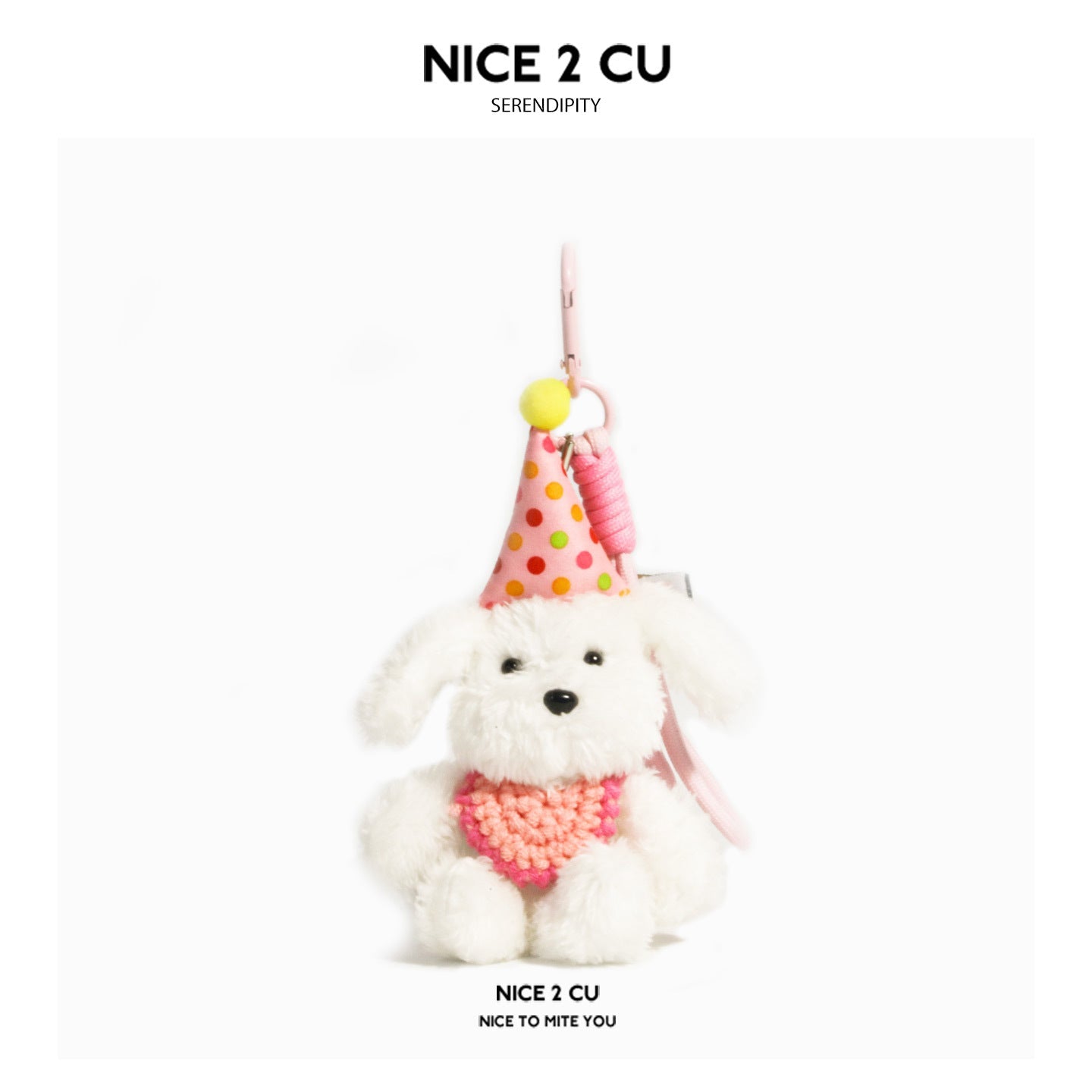 Cream white plush dog keychain charm with pink polka-dot birthday hat and pink bib accent