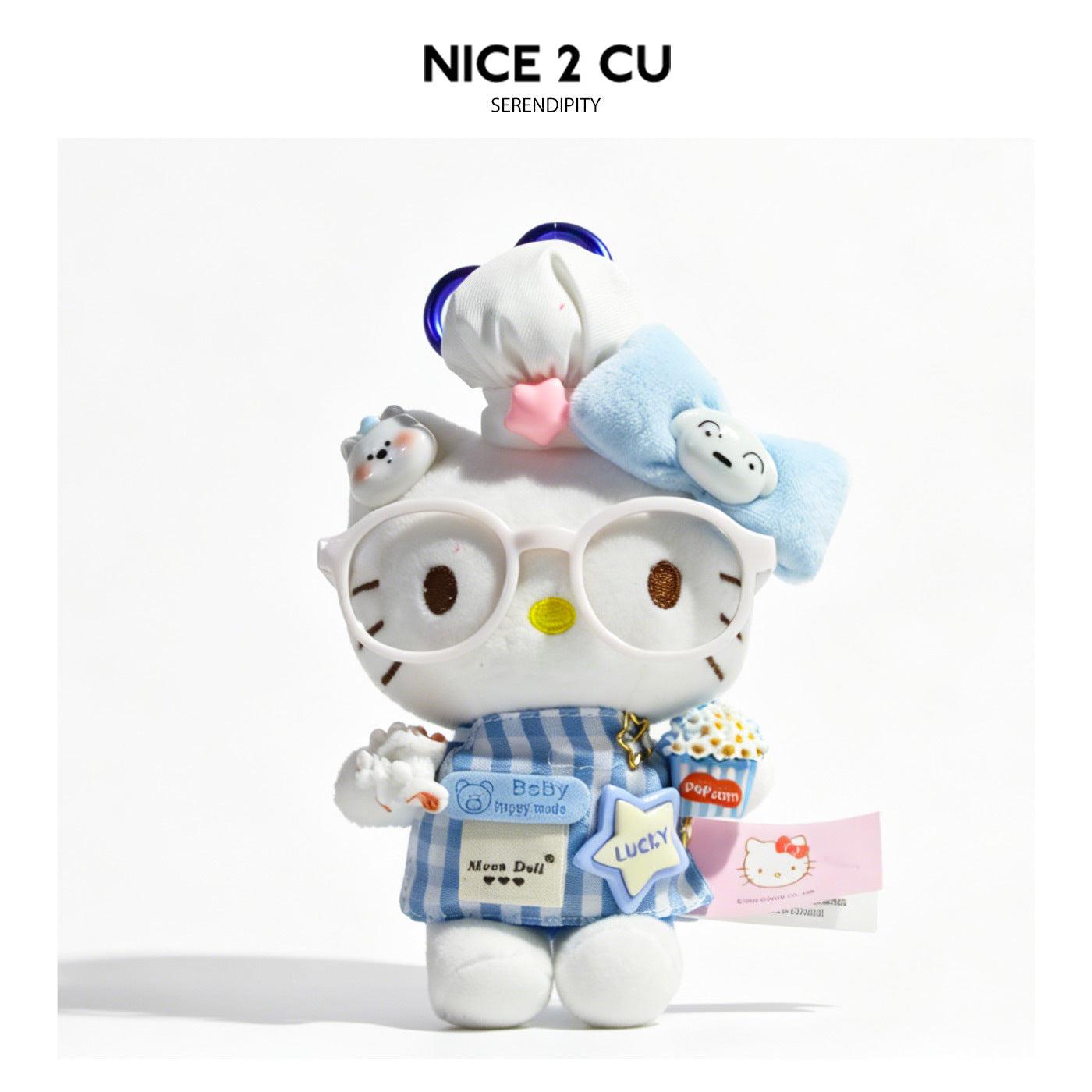 Kawaii cat plush charm wearing glasses and blue checkered apron with popcorn bucket accessory