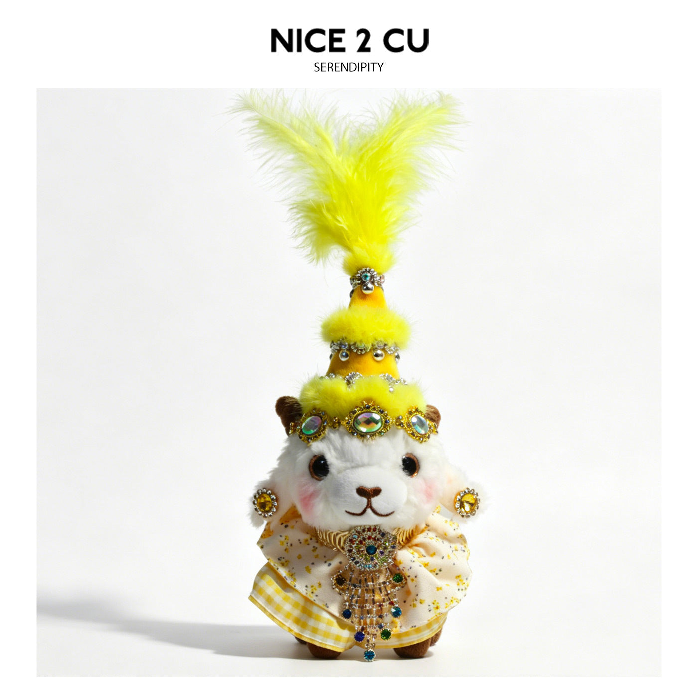 White plush lamb figurine wearing a bright yellow conical hat with tall chartreuse feather plume and multicolor jeweled penda